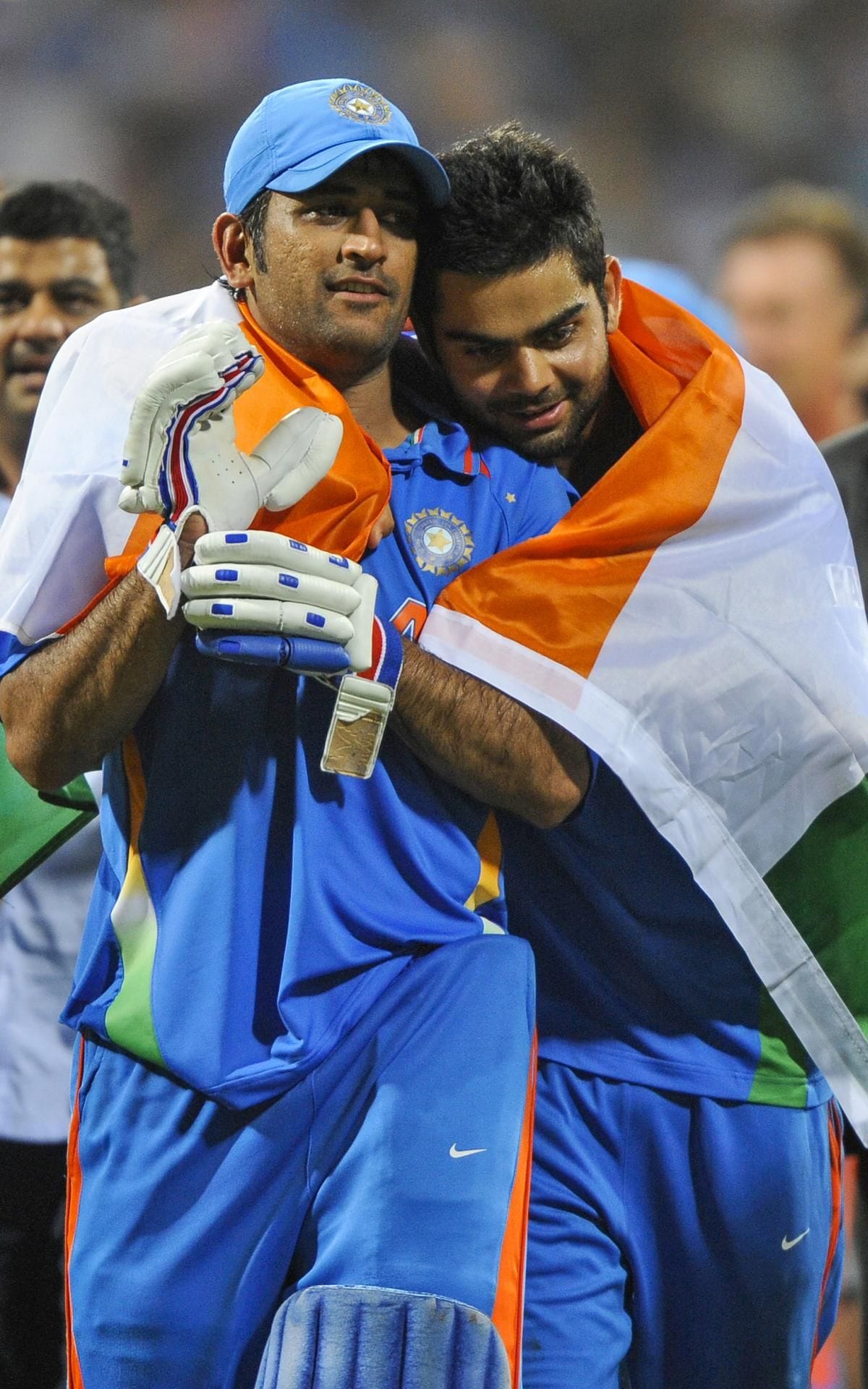 Mahendra Singh Dhoni and Virat Kohli after India wins the World Cup in Mumbai, April 2011